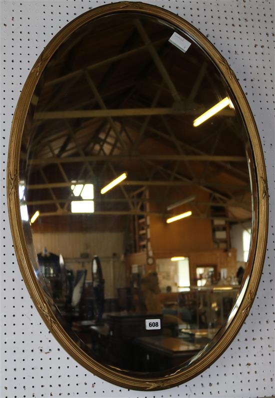 Gilt frame oval wall mirror